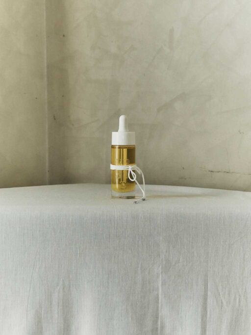 Glass dropper bottle with Angels Drops essence and white rope details